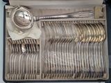 a box with a bunch of silverware in it