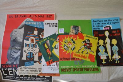 many different posters on the wall of a room