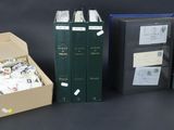 three open books in a box sitting next to each other on a table