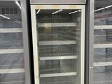 two refrigerators that are sitting in a store