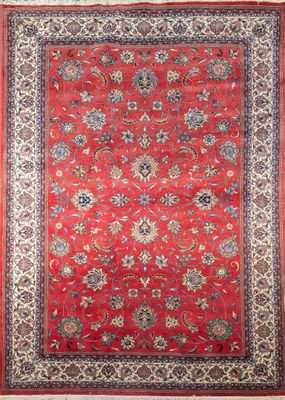 a red rug with a floral design on a white background