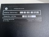 a close up of the back of a laptop with a barcode on it