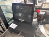 a cash machine that is sitting in front of a window