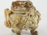 an image of a very old looking vase on a white surface