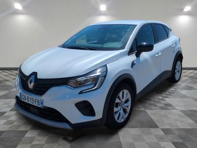 a white car parked in a room with a checkered floor