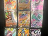 a close up of a bunch of pokemon cards on a table