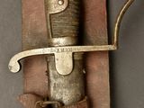 a knife that is attached to a hook on a wall