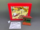 toy train station in a red box with a sign and instructions