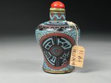 an image of a blue and red vase with a tag on it