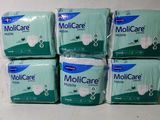 six paquets de Molicare Molicare Molicare Molicare Molicare Molicare Molicare Molicare Molicare Molica