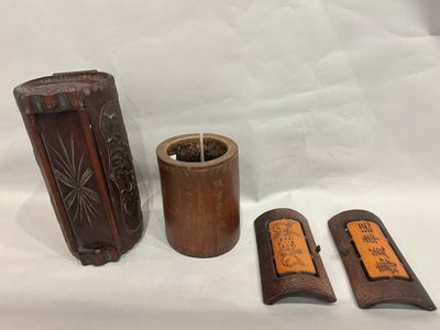 three wooden items that are sitting on a white surface