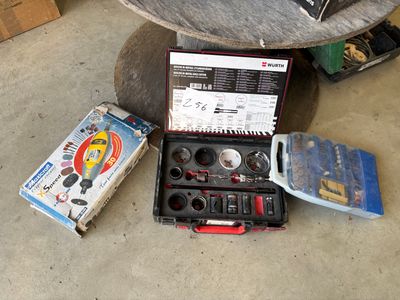 a box of tools sitting on the floor next to a table