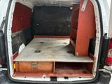 a small bed in the back of a van