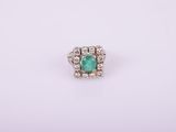 an emerald and diamond ring