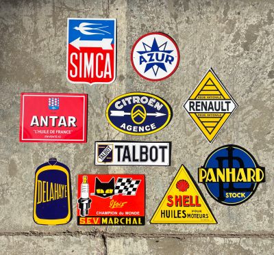 a lot of stickers on the wall of a building