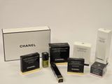 chanel cosmetics products displayed on a white surface with a white background