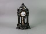 a small clock that is sitting on a table