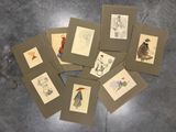 a lot of cards with drawings on them on a table