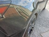 a car that is parked on the side of the street