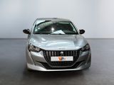 the front view of a silver car in a white room