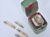 a small box with a metal object inside of it