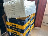 boxes stacked on top of each other on a chair in a room