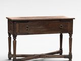 an old wooden table with two drawers and a drawer underneath it