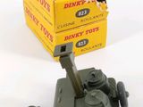 two boxes of dinky toys sitting next to each other