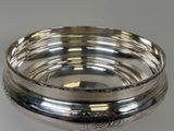 silverplated bowl with floral design on the rim and bottom
