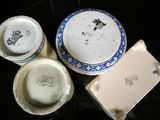 three bowls and two cups sitting on a table