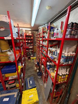 a room with a lot of shelves filled with supplies