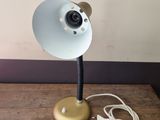 a lamp that is sitting on a wooden table