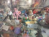 a display case with a lot of action figures in it