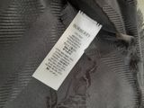 a label on the back of a jacket that says burberberry