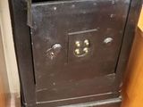 an old black stove in the corner of a room
