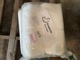 a bag of white toilet paper sitting on a pallet