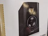 a box with a speaker inside of it sitting on the floor