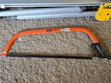a saw and a hand saw on the floor