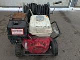an image of a red and white engine and a hose