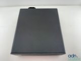 a close up of a laptop computer sitting on a white surface