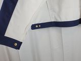 a close up of a white shirt with blue trims