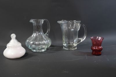 three glass vases sitting next to each other on a table