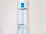the bottle of la rochene thermal water is sitting on a table