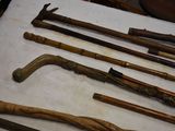 many different types of walking canes on a table