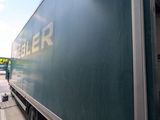 a truck that is parked next to a building