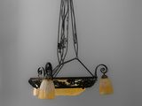 a black and white photo of a chandelier hanging from the ceiling
