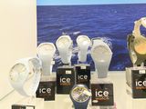 a lot of watches on display on a glass table