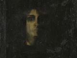 un tableau représentant le visage d'un homme, dans un cadre noir