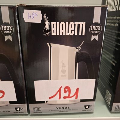 two boxes of wii controllers are on a shelf in a store