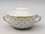 a close up of a bowl with a lid on a white surface